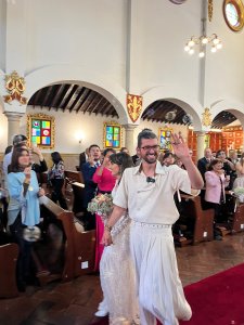 Couple walks down wedding aisle